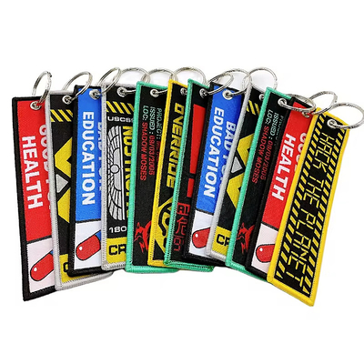 Impressão em branco personalizada Carta alfabética Chaves de chave de dois lados Chaves de chave bordadas tecidas Chaves de chave de cordas curtas
